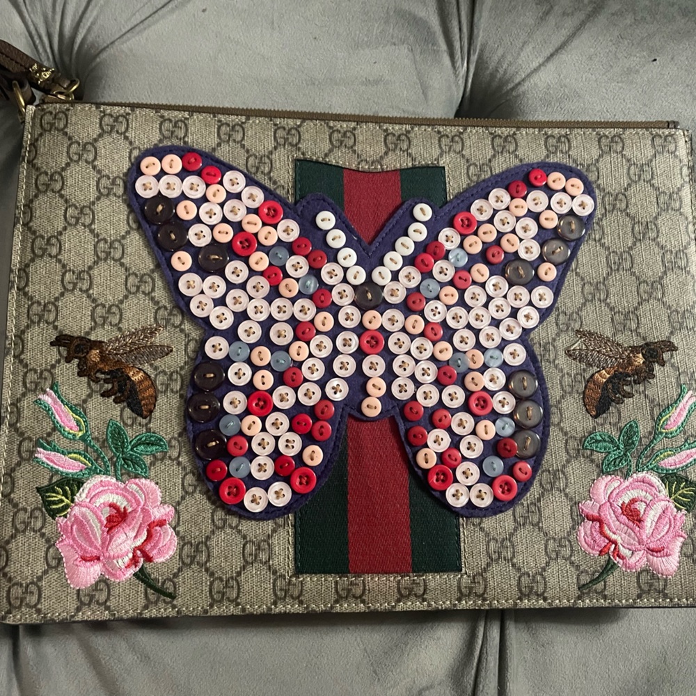 Gucci Supreme GG monogram butterfly envelope clutch in excellent condition!